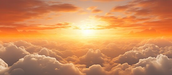 Wall Mural - A scenic view of a vibrant sunset above a cloudy sky, with a distant airplane flying in the horizon