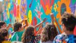 © panyawatt - Illustrate the impact of art outreach programs by showcasing a vibrant mural being painted by community members of all ages, as seen from behind Emphasize the sense of unity, self-expression, and crea