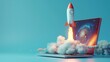 © Ace64 Studio - Rocket coming out of laptop screen, blue background