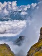 View of the mountains between the clouds in the Dolomites, Italy