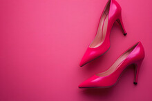 A Pair Of Elegant High Heels On A Striking Hot Pink Background, Symbolizing Fashion And Sophistication 