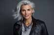 Portrait of a beautiful middle-aged woman in leather jacket.