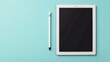 © chanidapa - digital tablet and stylus pen on light blue background