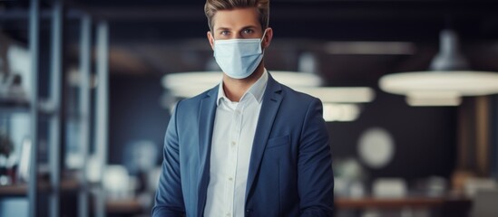 Poster - A man with a beard and facial hair, wearing a blazer and hat with eyewear, is standing in an office wearing a mask and sleeve