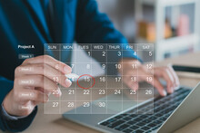 Calendar on the virtual screen interface. Businessman manages time for effective work.  Highlight appointment reminders and meeting agenda on the calendar. Schedule management concept.