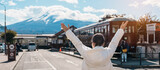 Fototapeta Kwiaty - Woman tourist with Fuji Mountain at Kawaguchiko train station, happy Traveler sightseeing Mount Fuji in Yamanashi, Japan. Landmark for tourists attraction. Japan Travel, Destination and Vacation