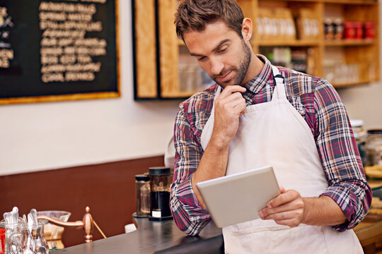 Man, barista and tablet for reading in cafe with ideas, thinking and decision for online menu. Person, waiter and digital touchscreen for solution, problem solving or order on website in coffee shop