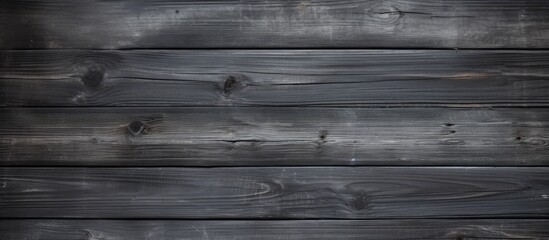  A detailed view of a wooden wall set against a dark background