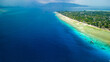 Aerial view of a coral reef wall surrounding a small tropical island (Gili Air, Indonesia)