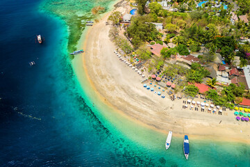 Sticker - Top down aerial view of a tropical beach and resorts on a small island