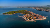 Fototapeta Na drzwi - Krapanj, Croatia - Aerial panoramic view of Krapanj island (Otok Krapanj), the smallest inhabited island in Croatia. Yachts, red rooftops and clear blue sky on sunny summer morning by the Adriatic sea