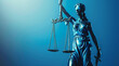Lady Justice statue in blue hues, holding balanced scales,