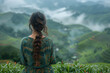 Young Vietnamese woman with long hair standing in a field, turned away copy space 