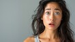 © Salander Studio - portrait of a pretty young asian woman looking scared in the camera