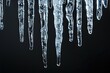 Icicles hanging isolated on black background