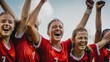 Portrait of happy female soccer players having fun on field during game