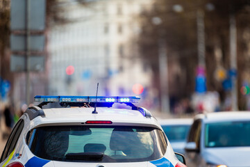 Poster - Police car signal close up in streets for patrolling or doing car stop