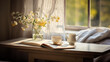 A table with a cup of coffee and a vase of flowers in front of a window with sunlight streaming through.