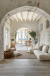 interior design photo of an architectural of a well maintained and luminous Tuscan house in white stone texture and with luxury furniture