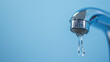 Close-up of a dripping faucet with water drop.