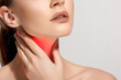 © julijadmi - Sore Throat Pain Concept. Close-up of a woman's lower face and neck with a red highlighted area on her throat, indicating pain or discomfort.