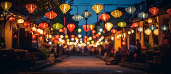 A city street adorned with vibrant lanterns illuminating the facade of buildings, creating a colorful display of art and design in the midnight hours