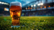 © PLATİNUM - Refreshing beer glass on grass with football stadium background