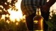 Silhouette of a man's big belly in the background, a bottle of apple cider vinegar in the foreground, concept: lose weight, healthy, fat melting, secret tip, copy and text space, 16:9