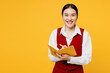 © ViDi Studio - Young fun corporate lawyer employee business woman of Asian ethnicity wear formal red vest shirt work at office hold in hand diary notebook isolated on plain yellow background studio. Career concept.