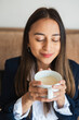© ADDICTIVE STOCK - Savoring the Aroma of Fresh Coffee with Eyes Closed