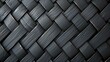 Black and gray wicker basket texture. The image is a close-up of the basket, showing the intricate weave of the wicker.
