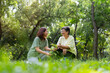 © Prot - Old Asian Women and daughter join as volunteers for reforestation, earth conservation activities for reduce global warming growth feature and take care nature earth. Environment Concept