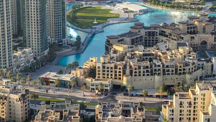 Wall Mural - Top view of the bridge over man-made lake timelapse in Dubai downtown, United Arab Emirates.