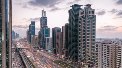 Poster - Downtown Dubai towers day to night timelapse. Aerial view of Sheikh Zayed road with skyscrapers after sunset.