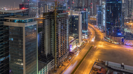 Wall Mural - Dubai business bay towers night timelapse aerial