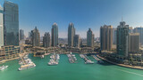 Fototapeta  - Dubai Marina skyscrapers aerial all day timelapse, port with luxury yachts and marina promenade