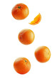 Falling orange isolated on white background, clipping path, full depth of field