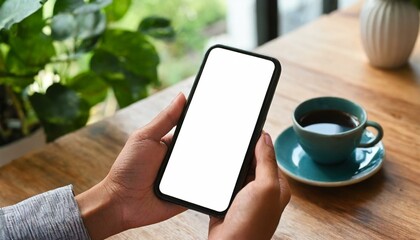 Mobile Phone for Mockup - Mobile Phone held by Hand at a desk or Cafe, at Home Environment - Template for Application Presentation