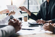 © Wasan - Meetings to discuss investment advisors together analyzing financial data, business growth graphs and charts, and planning business strategies.