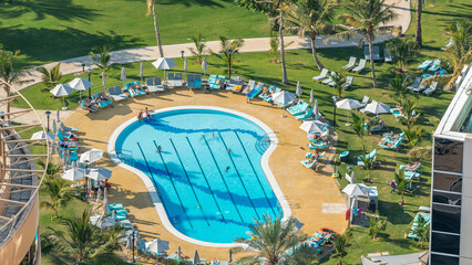 Wall Mural - The view from skyscraper on swimming pools timelapse, Dubai, UAE