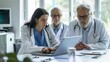 Diverse group of medical specialists reviewing electronic health records on laptop
