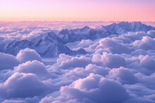 An Endless Sea Of Clouds, Snow-capped Mountains Visible In Front, And A Blue-purple Color At Dusk. Sunlight Shines On The Snowy Mountain Peaks. Majestic Landscape Concept.