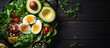 A dish of avocado, hardboiled eggs, tomatoes, spinach, and nuts served on a wooden table with a flower centerpiece. Perfect for any event as a healthy finger food choice