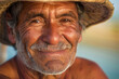 Sun-kissed skin, deeply tanned from a lifetime by the sea. His hands are calloused from fishing, and his smile is genuine close up, portrait,