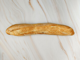 Sticker - baguette de pain, en gros plan, sur une table