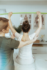 Poster - female therapist in massage cabinet doing checkup