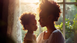 Fototapeta  - Portrait of a mother and daughter looking at each other at home. 