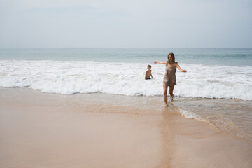 Wall Mural - Summer vacation of mother and son in tropical country