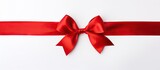 Fototapeta  - Close up of red ribbon with bow