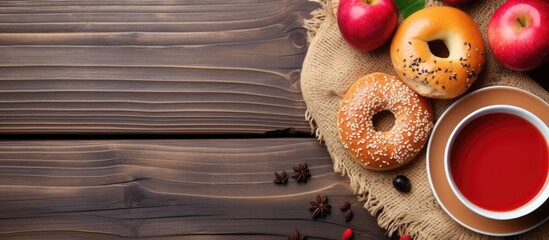 Wall Mural - A close up of a bagel, apples, and a cup of coffee